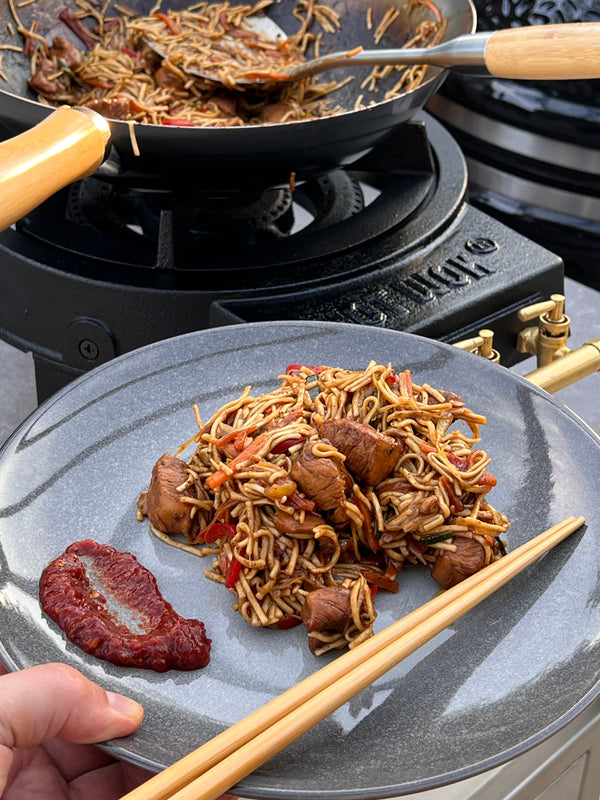 Asian stir-fry with chicken, fresh vegetables and noodles